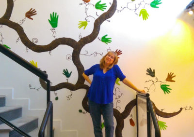 me with the "Helping Hands" 30' by 40' mural inside the CNIB Community Hub on 1525 Yonge St, Toronto. Open to the public.